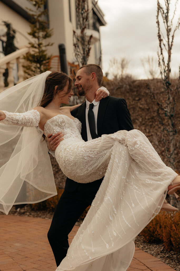 groom kissing the bride on the forehead