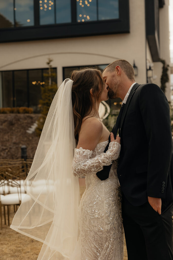 portrait of the bride and groom kissing