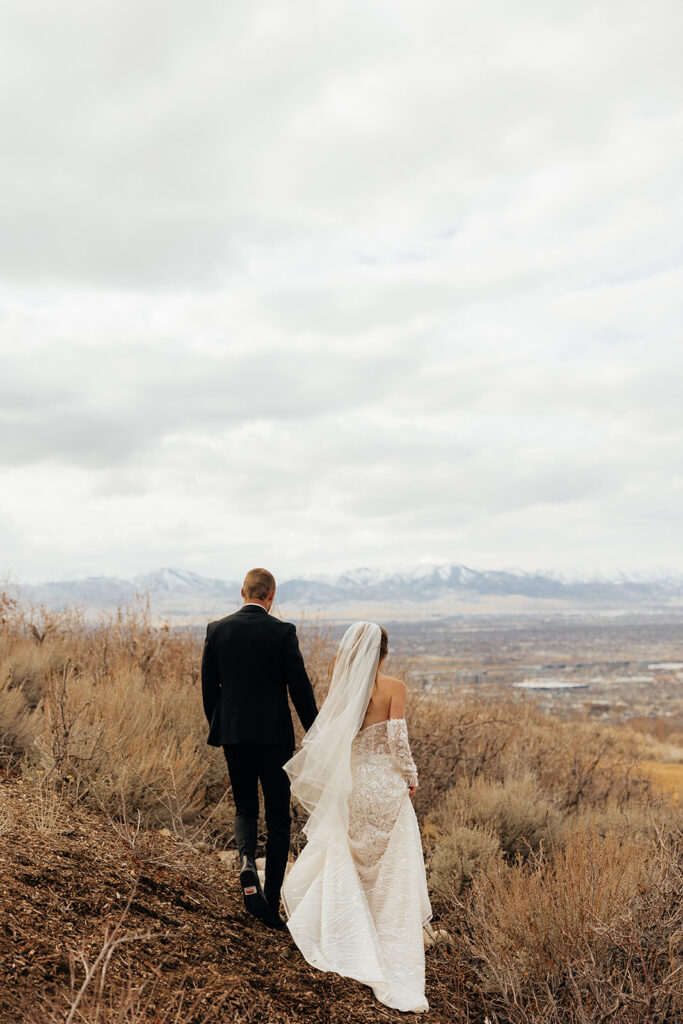 cute portrait of the newlyweds holding hands during their photoshoot