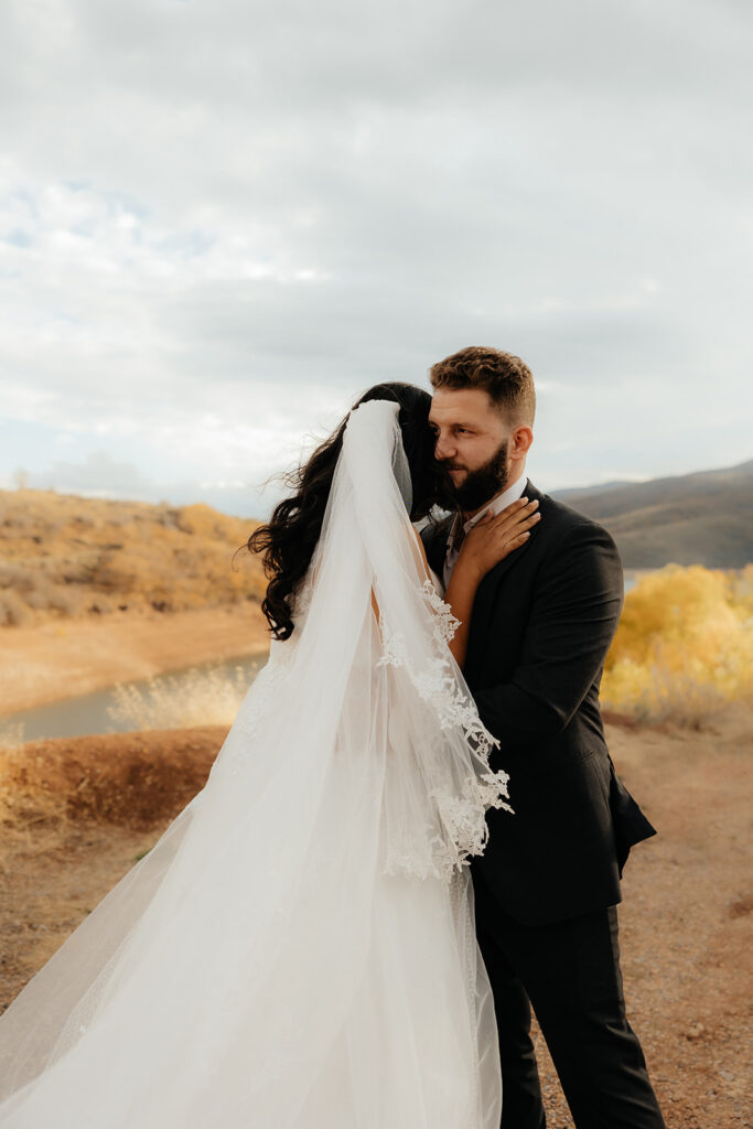cute picture of the bride and groom hugging