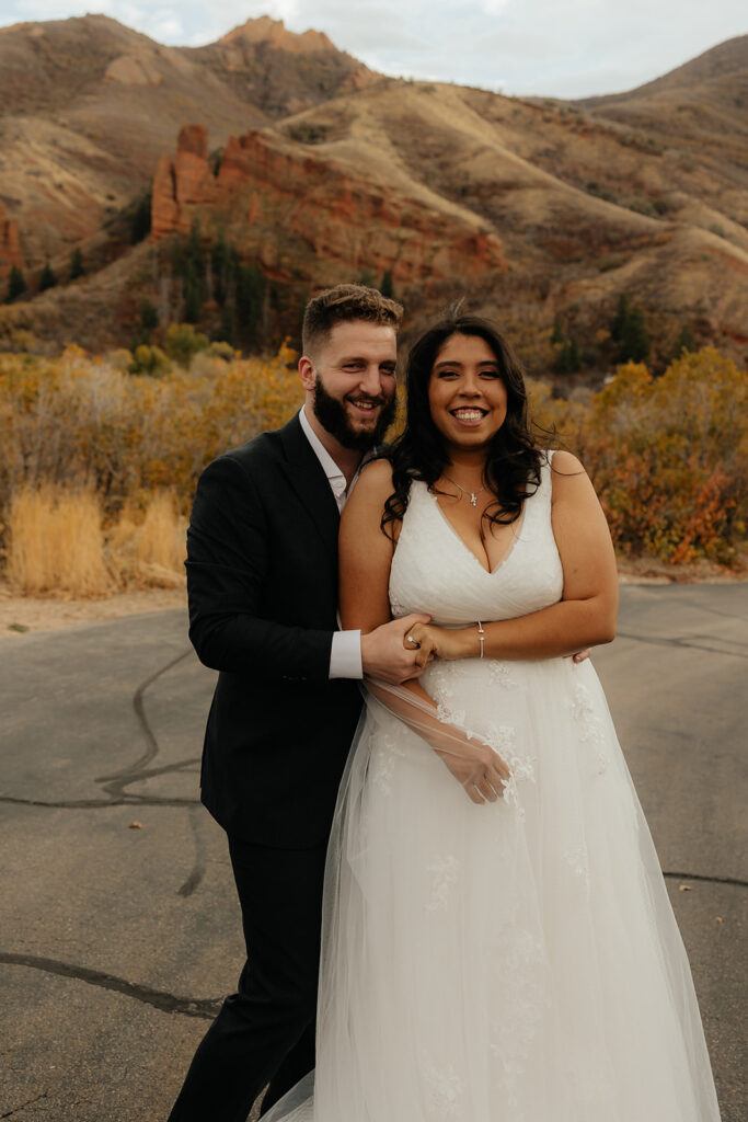 couple laughing with each other during their bridal session