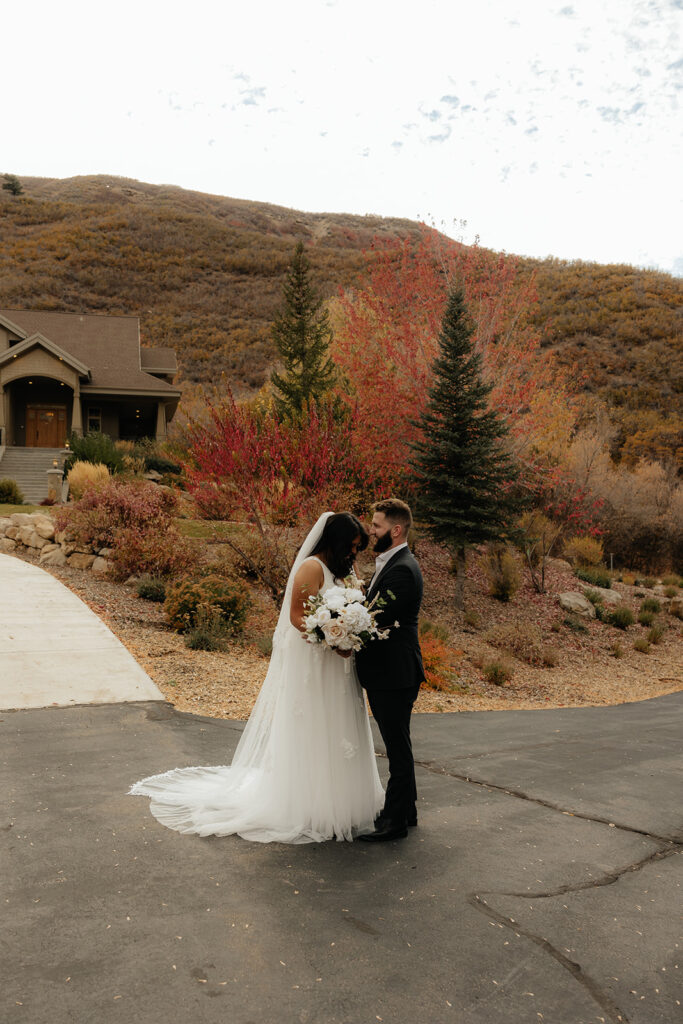 groom kissing the bride on the forehead 