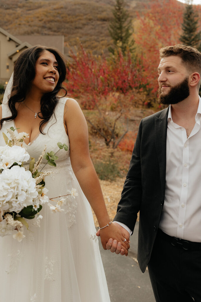 cute picture of the newlyweds holding hands