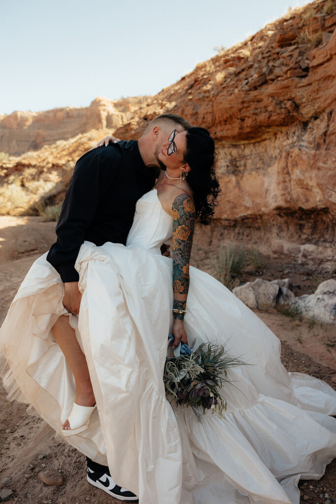 groom kissing the bride on the cheek