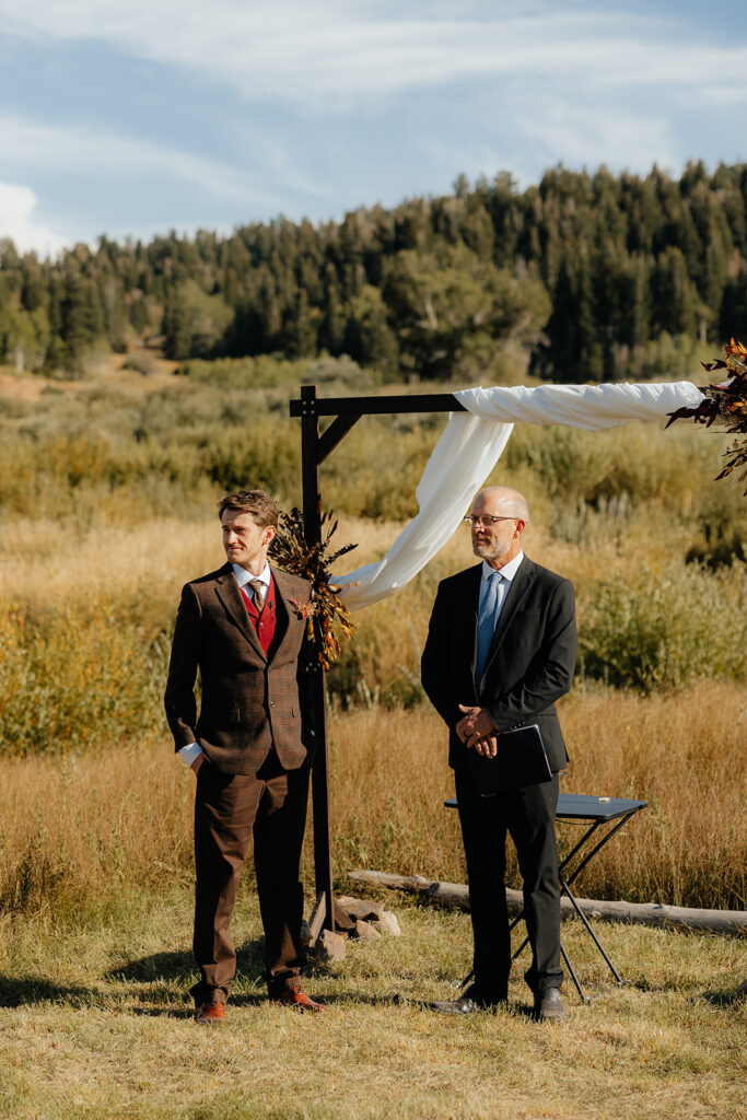 groom emotional watching the bride walk down the aisle
