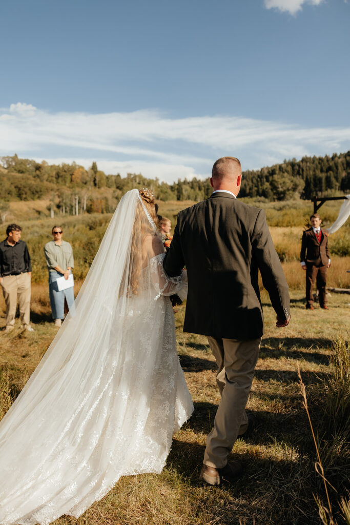 cute picture of the bride walking down the aisle