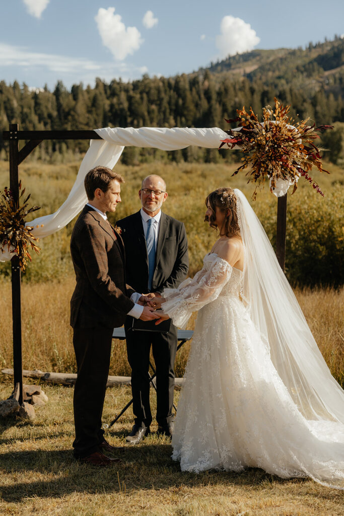picture of the bride and groom holding hands