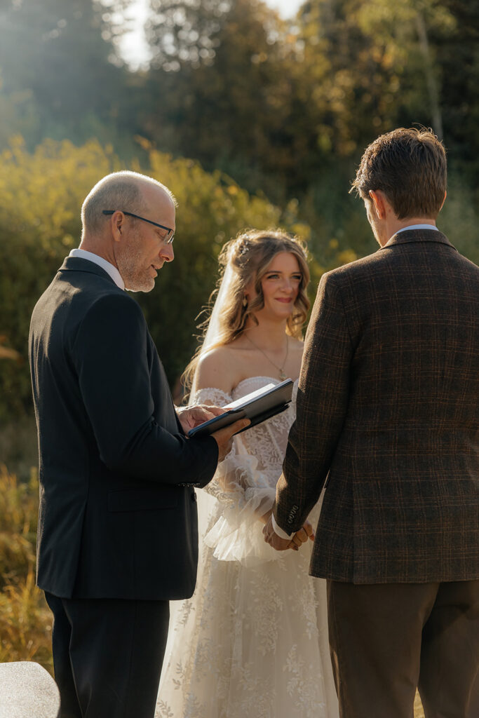 cute couple smiling at each other during their ceremony