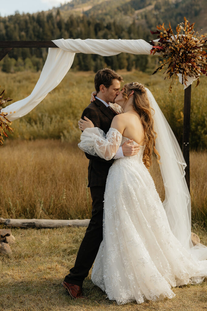 couple kissing after their wedding ceremony