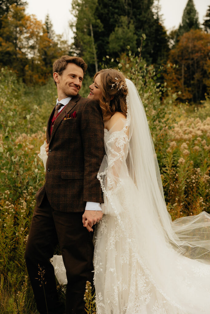 picture of the newly married couple smiling at each other