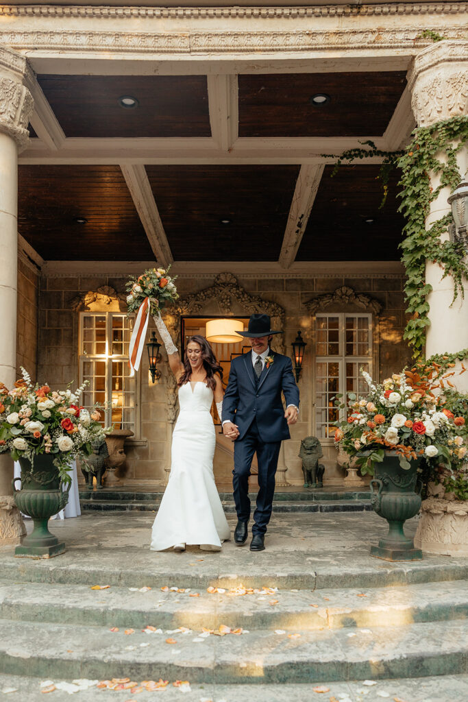 cute picture of the newlyweds entering their wedding reception