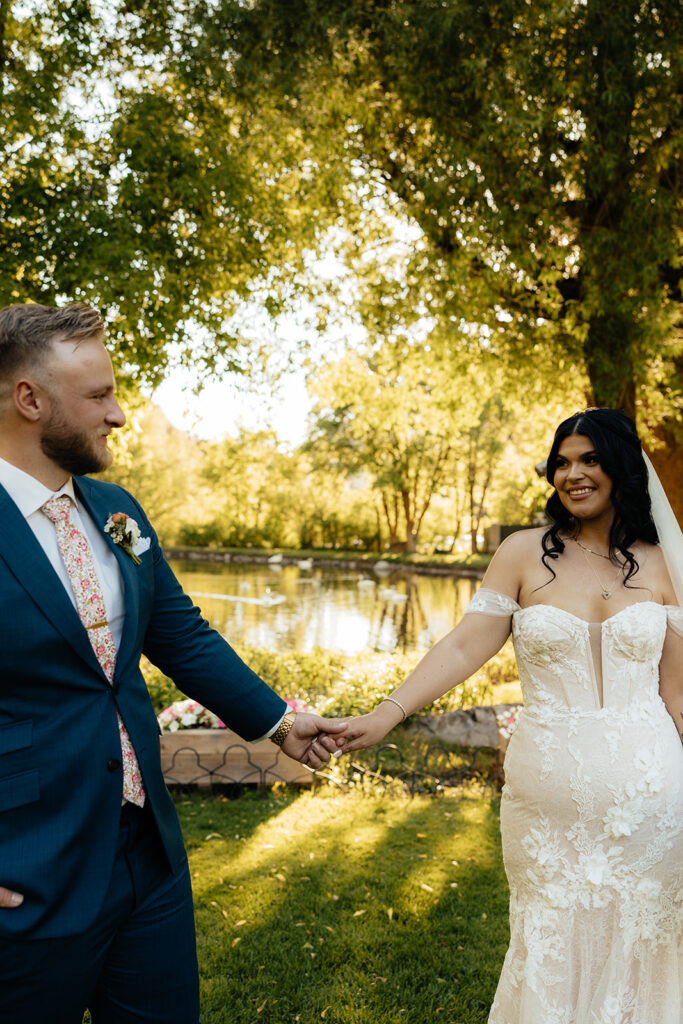 portrait of the newlyweds holding hands