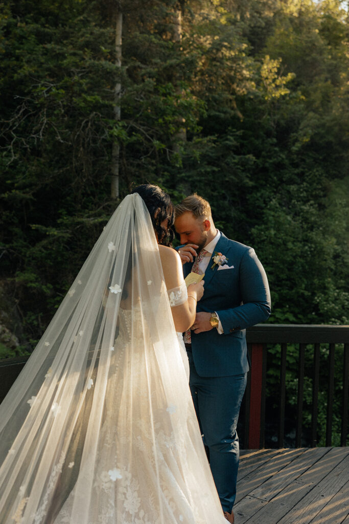 groom kissing the brides hand