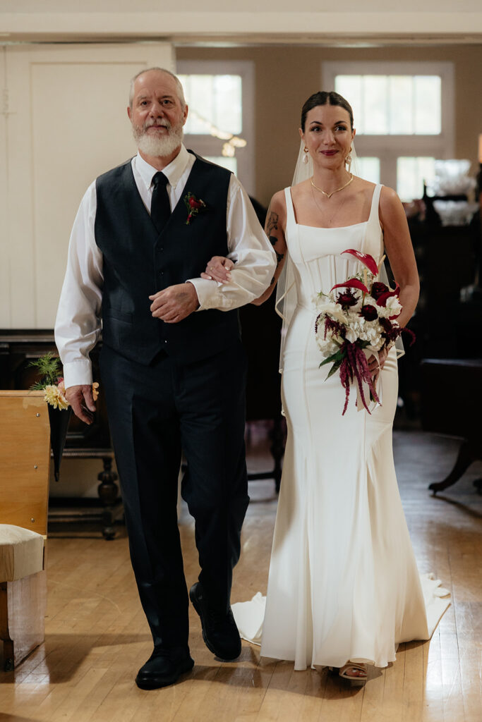 stunning picture of the bride walking down the aisle