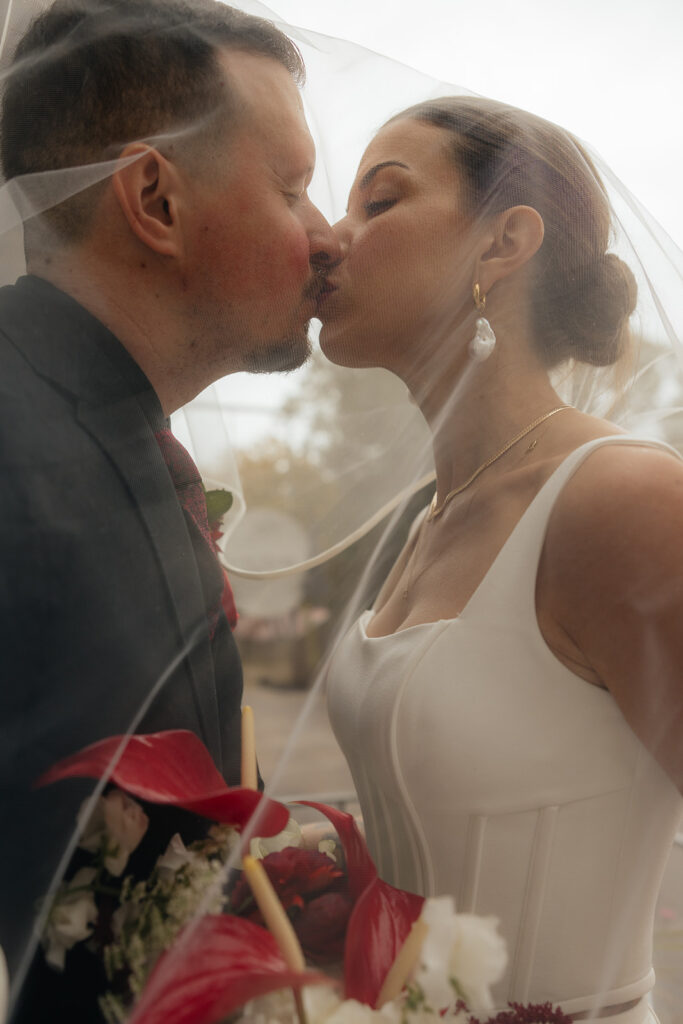 cute picture of the bride and groom kissing