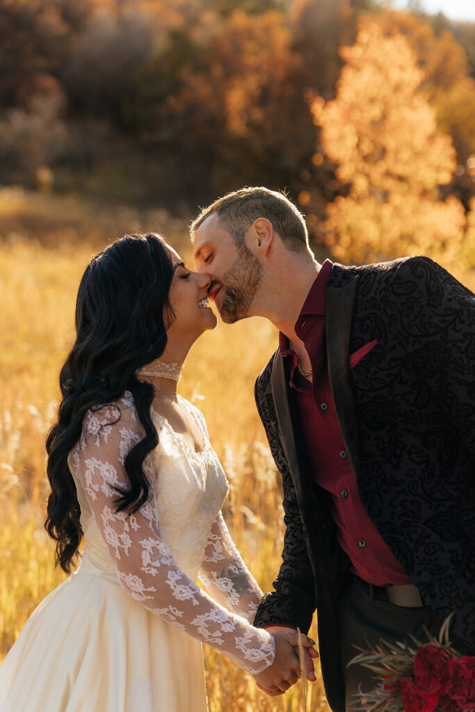 picture of the bride and groom kissing during their photoshoot