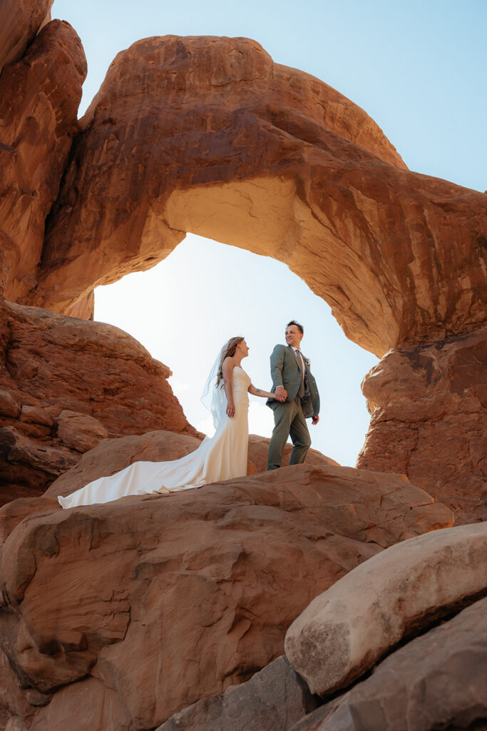 Portrait of the bride and groom, holding hands