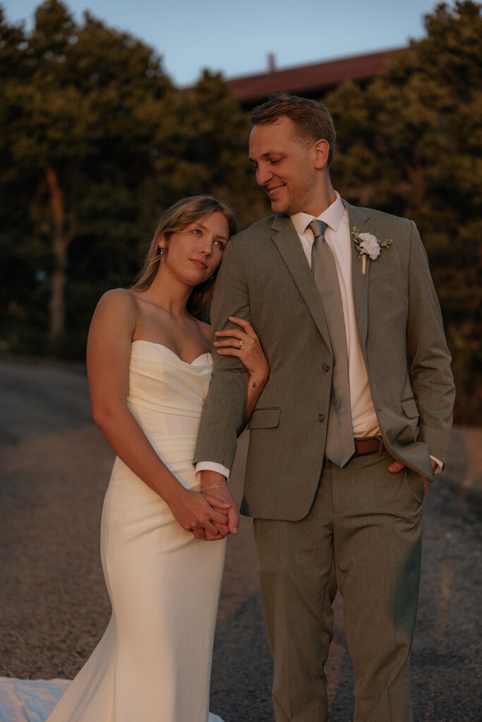 Portrait of the bride and groom, holding hands
