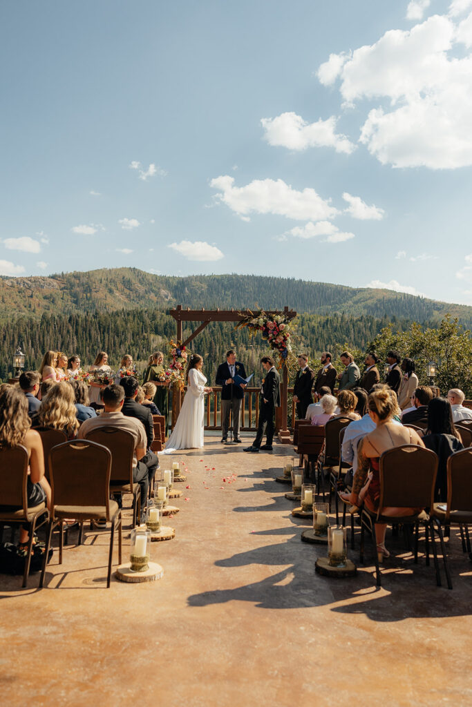 bride and groom holding hands during their wedding ceremony