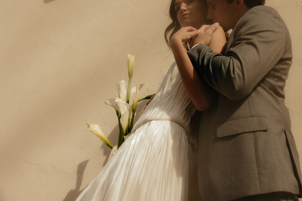 cute picture of the bride and groom hugging