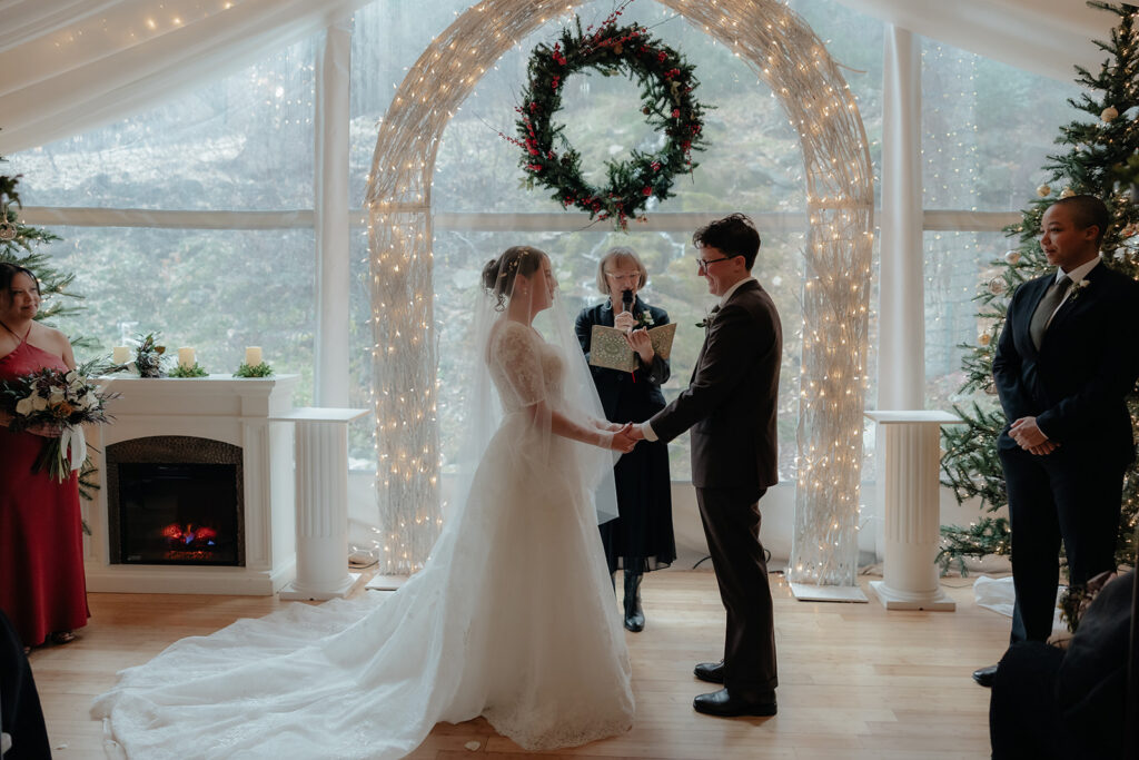 bride and groom holding hands during their ceremony
