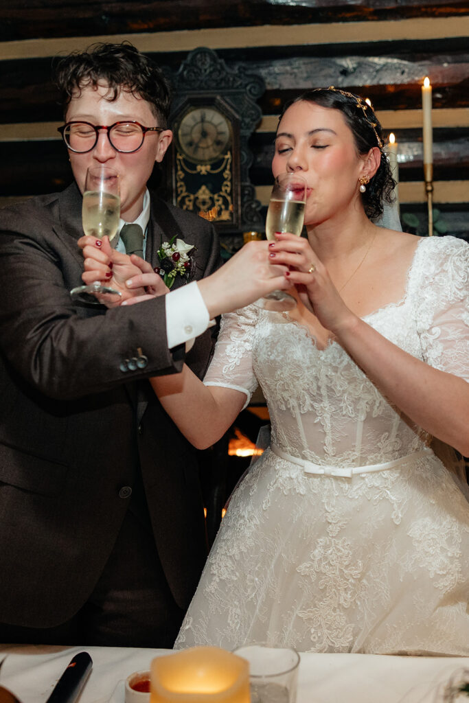 Newly married couple celebrating their wedding with champagne