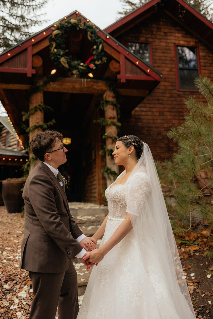 Cute portrait of the newly married couple holding hands