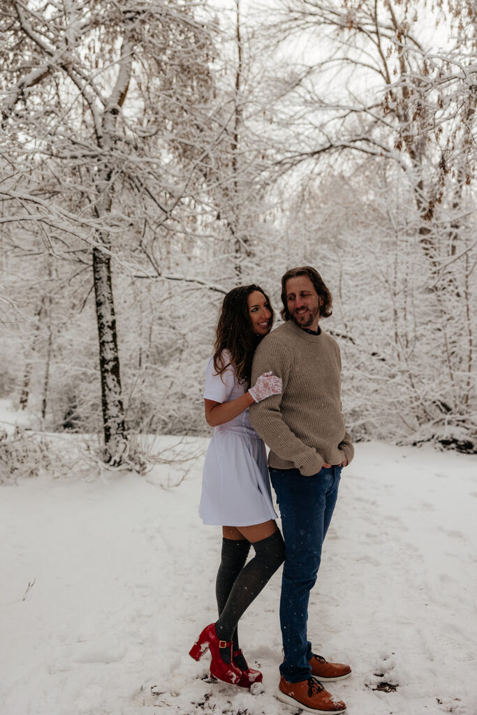 cute picture of the newly engaged couple smiling at each other