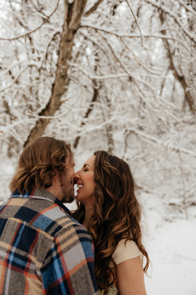cute picture of the newly engaged couple laughing with each other