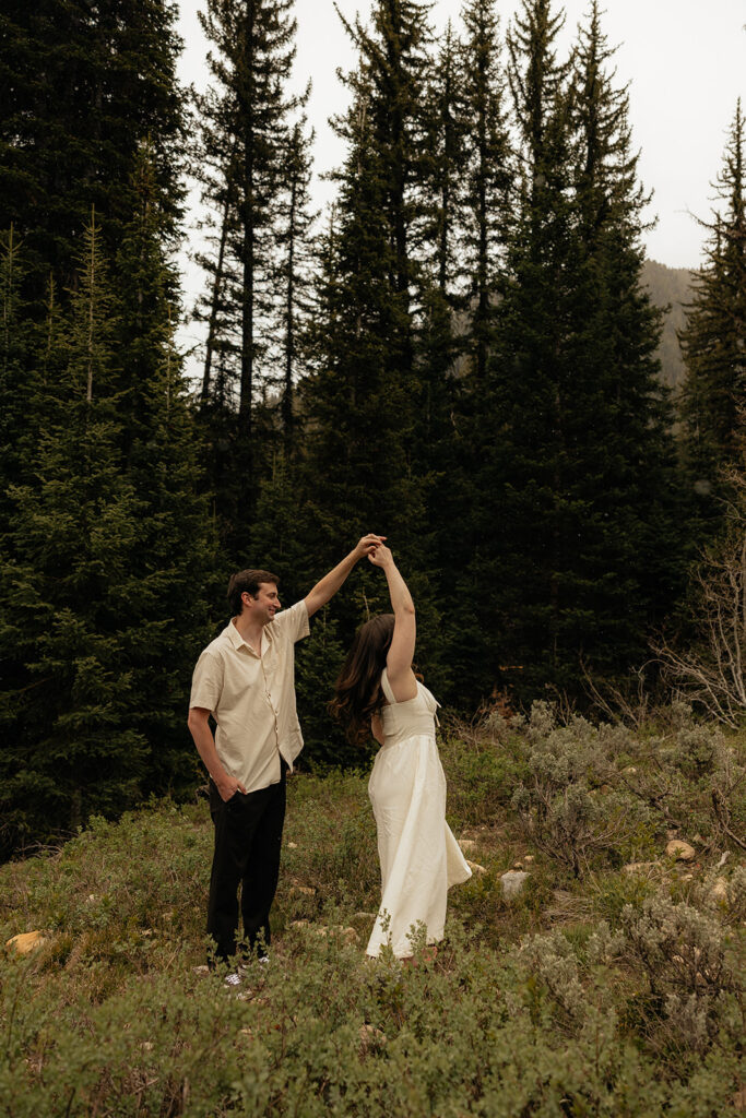 cute picture of the newly engaged couple dancing during their photoshoot