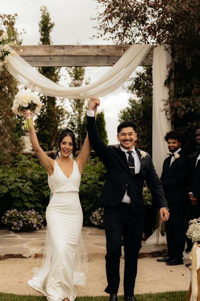 newlyweds heading to their wedding reception