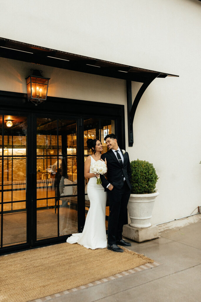 beautiful picture of the bride and groom smiling at each other