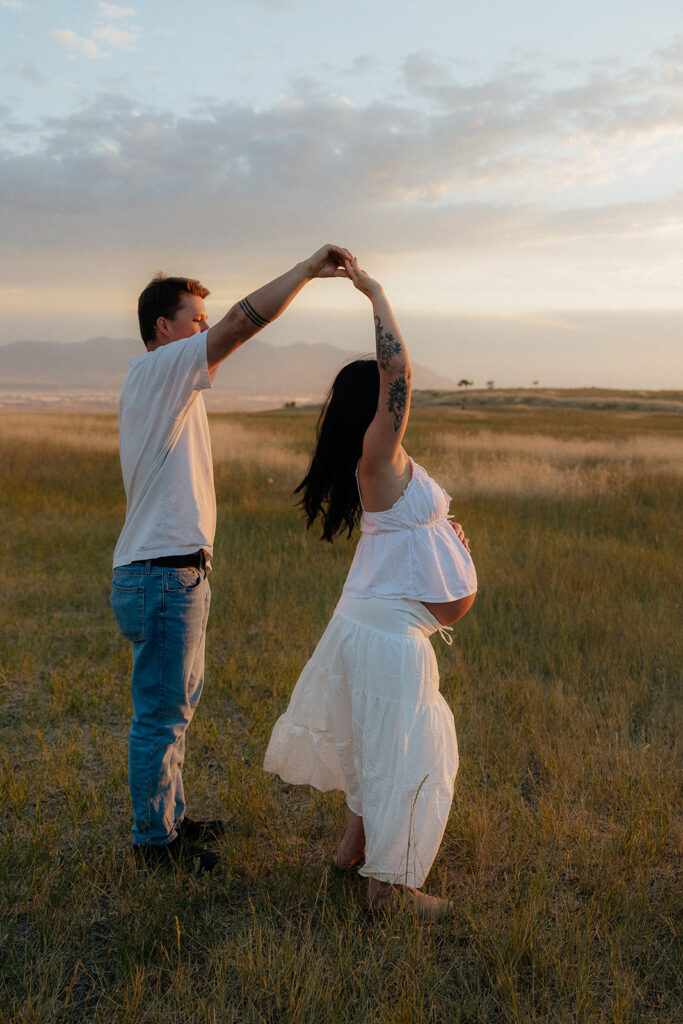 couple dancing during their maternity session