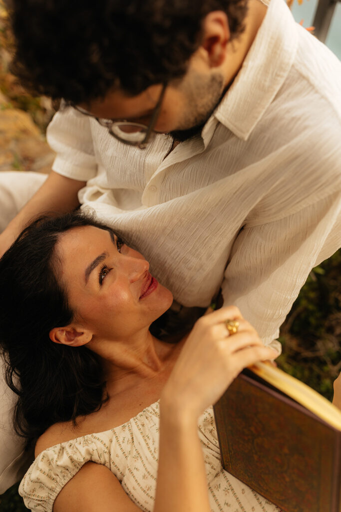 couple smiling at each other during their photoshoot