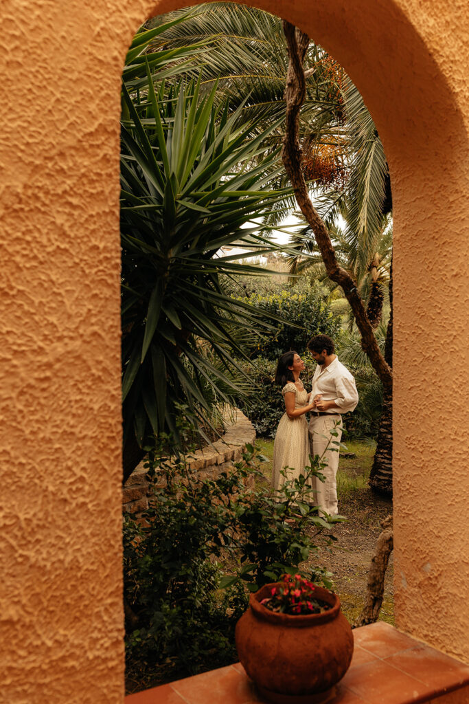 couple smiling at each other during their session