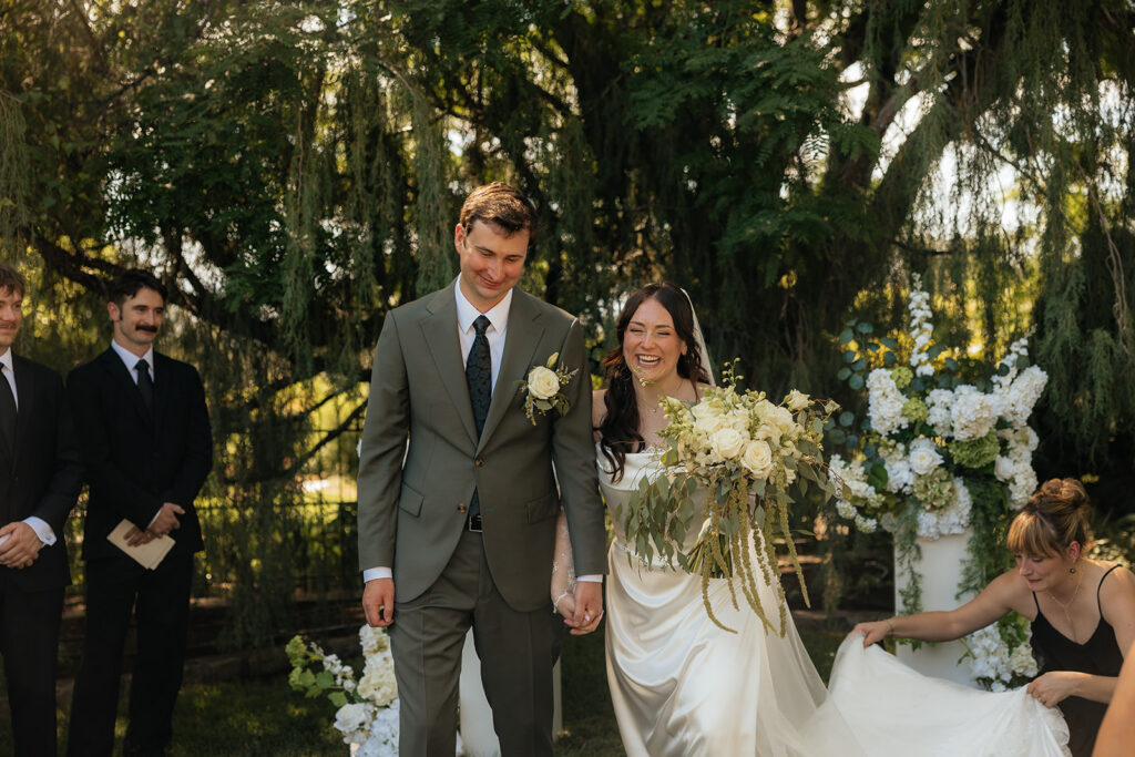 cute picture of the newlyweds heading to their wedding reception