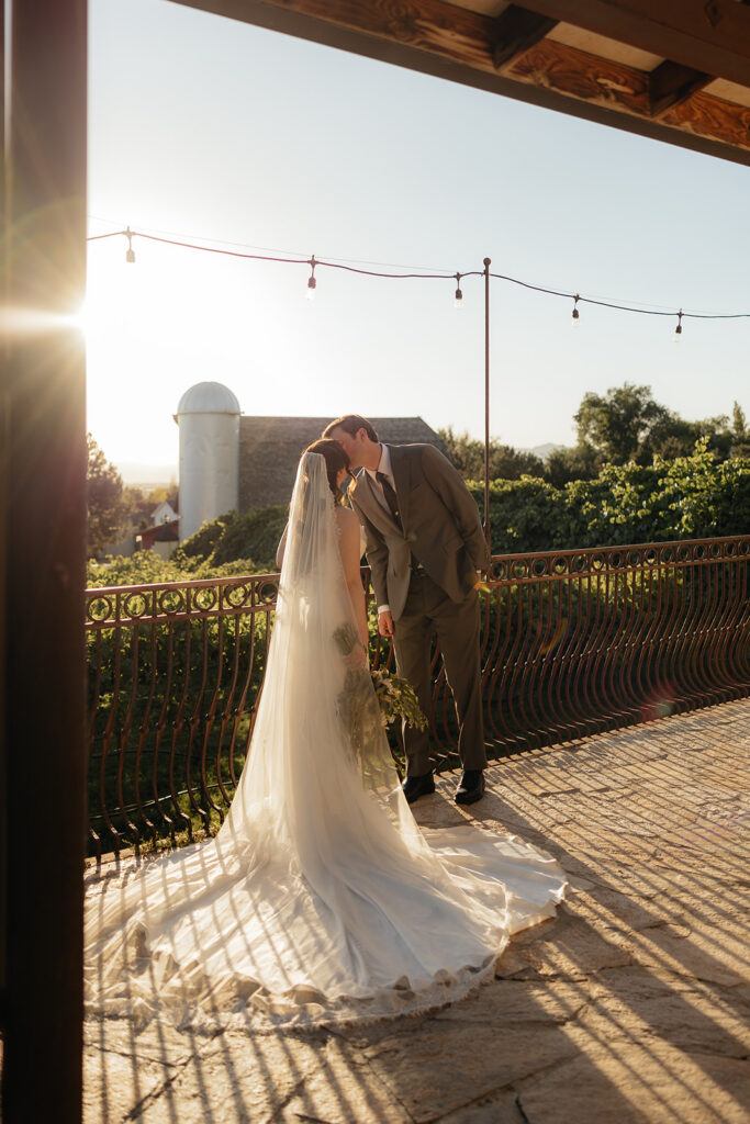 cute picture of the newlyweds kissing