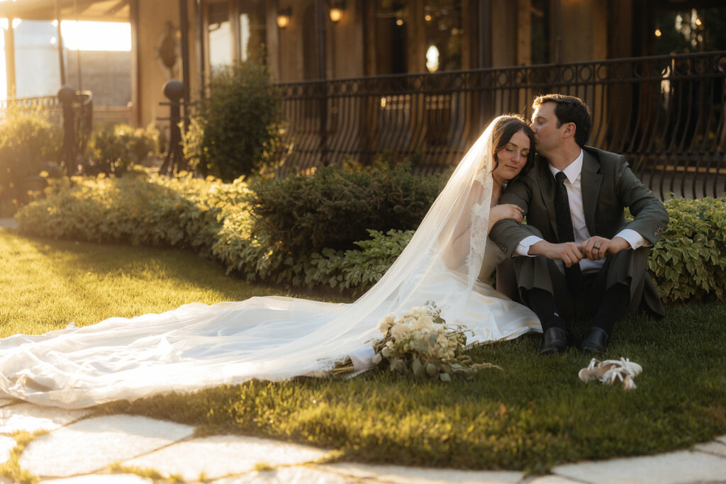 cute picture of the groom kissing the bride on the forehead